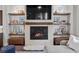 Elegant fireplace with stone surround, built-in shelving, and stylish decor at 4169 San Capri Way, Las Vegas, NV 89141