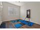 Bright flex room featuring hard wood floors and white shutters, with workout equipment at 4169 San Capri Way, Las Vegas, NV 89141