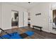 Bright flex room leading to Kitchen and Patio featuring hard wood floors and workout equipment at 4169 San Capri Way, Las Vegas, NV 89141