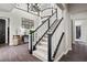 Grand foyer showcasing a beautiful staircase, chandelier, and dark wood flooring accents at 4169 San Capri Way, Las Vegas, NV 89141