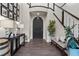 Grand foyer with dark wood floors, a curved staircase, and stylish decor at 4169 San Capri Way, Las Vegas, NV 89141
