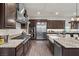 Spacious kitchen with stainless steel appliances, granite countertops, and ample cabinet space at 4169 San Capri Way, Las Vegas, NV 89141