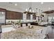 Modern kitchen with granite countertops, stainless steel appliances, and a large island with seating at 4169 San Capri Way, Las Vegas, NV 89141