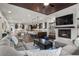 This expansive living room features an open floor plan, modern fireplace, and seamless flow to the gourmet kitchen at 4169 San Capri Way, Las Vegas, NV 89141