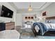 Large Primary suite with a view into the living room, featuring a comfortable bed and modern decor at 4169 San Capri Way, Las Vegas, NV 89141