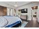 Bright main bedroom featuring a barn door entry, a chandelier, and neutral-toned walls at 4169 San Capri Way, Las Vegas, NV 89141