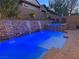 Beautiful outdoor oasis featuring a pool, spa, and waterfall wall for ultimate relaxation at 4169 San Capri Way, Las Vegas, NV 89141