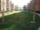 Expansive green common area lined with trees, offering a tranquil and inviting space at 50 E Serene Ave # 321, Las Vegas, NV 89123