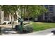 Community dog park featuring green space, waste station, and walking path at 50 E Serene Ave # 321, Las Vegas, NV 89123