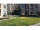 Manicured front yard with lush green grass, landscaping, and colorful flowering shrubs at 50 E Serene Ave # 321, Las Vegas, NV 89123