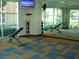 Bright fitness room with weight benches, exercise equipment and plenty of open space and natural light at 50 E Serene Ave # 321, Las Vegas, NV 89123