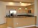 Bright kitchen with granite countertops, stainless steel appliances, and plenty of cabinet space at 50 E Serene Ave # 321, Las Vegas, NV 89123
