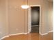 Living room with hardwood floors and neutral paint, leading to bedroom at 50 E Serene Ave # 321, Las Vegas, NV 89123