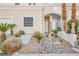 Charming home featuring desert landscaping, a well-manicured front yard, and inviting curb appeal and freshly painted at 5077 Thunder River Cir, Las Vegas, NV 89148