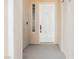 Inviting front door with modern details and a welcoming entrance, alongside decorative glass block and neutral tones at 5077 Thunder River Cir, Las Vegas, NV 89148