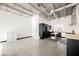 Spacious industrial kitchen featuring modern black cabinetry and stainless steel appliances at 5077 Thunder River Cir, Las Vegas, NV 89148