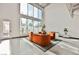 Modern living room with high ceilings, large windows, and stylish furnishings at 5077 Thunder River Cir, Las Vegas, NV 89148