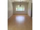 Inviting dining room with hardwood floors and a classic chandelier at 5147 Villa Vecchio Ct, Las Vegas, NV 89141