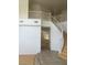 Spacious entryway showcasing a curved staircase and an open floor plan at 5147 Villa Vecchio Ct, Las Vegas, NV 89141