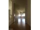 Bright hallway with hardwood floors and a view of a room at 5147 Villa Vecchio Ct, Las Vegas, NV 89141