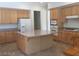 Spacious kitchen with granite countertops, stainless appliances, and a center island at 5147 Villa Vecchio Ct, Las Vegas, NV 89141