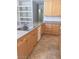 Kitchen featuring light wood cabinetry, granite countertops, and stainless steel appliances at 5147 Villa Vecchio Ct, Las Vegas, NV 89141