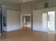 Open-concept living room with hardwood floors and neutral paint, creating a bright and welcoming atmosphere at 5147 Villa Vecchio Ct, Las Vegas, NV 89141