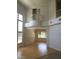 Open-concept living area featuring high ceilings, a balcony, and natural light from large windows at 5147 Villa Vecchio Ct, Las Vegas, NV 89141