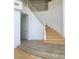 Elegant curved staircase with white railing and light wood steps at 5147 Villa Vecchio Ct, Las Vegas, NV 89141