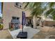 This backyard features a covered patio with outdoor seating and playful elements, perfect for relaxation and entertainment at 5213 Welch Valley Ave, Las Vegas, NV 89131