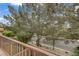 A cozy balcony offers views of mature trees and blue skies, creating a peaceful retreat at 5213 Welch Valley Ave, Las Vegas, NV 89131