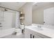 Bathroom featuring a shower-tub combo, tiled floors, and a vanity at 5213 Welch Valley Ave, Las Vegas, NV 89131