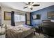 Bedroom featuring a dark blue accent wall, large window, and carpeted floors at 5213 Welch Valley Ave, Las Vegas, NV 89131