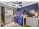 bedroom featuring a cozy bunkbed with a constellation themed decor at 5213 Welch Valley Ave, Las Vegas, NV 89131