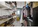 Organized closet with shoe racks and hanging clothes, providing ample storage space at 5213 Welch Valley Ave, Las Vegas, NV 89131