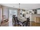 Bright dining area connected to the kitchen, featuring a spacious table and access to the outdoor patio at 5213 Welch Valley Ave, Las Vegas, NV 89131