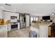 Modern kitchen featuring stainless steel appliances, granite countertops, and ample cabinet space for storage at 5213 Welch Valley Ave, Las Vegas, NV 89131