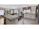 Bright kitchen featuring granite countertops, stainless appliances, and tile flooring at 5213 Welch Valley Ave, Las Vegas, NV 89131