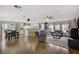 Inviting living room seamlessly blends into the kitchen and dining area, perfect for modern living and entertaining at 5213 Welch Valley Ave, Las Vegas, NV 89131