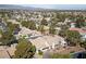 Picturesque desert neighborhood with golf course views and lush landscaping around a single-Gathering home at 5240 Las Cruces Dr, Las Vegas, NV 89130