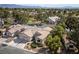 Scenic aerial view of a well-maintained single-Gathering home with desert landscaping and nearby golf course at 5240 Las Cruces Dr, Las Vegas, NV 89130