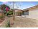 View of the backyard and desert landscaping of this lovely home at 5240 Las Cruces Dr, Las Vegas, NV 89130