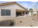 Large backyard area with textured surface and covered patio at 5240 Las Cruces Dr, Las Vegas, NV 89130