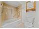 Bathroom with a tiled shower-tub, grab bars, and a neutral color scheme at 5240 Las Cruces Dr, Las Vegas, NV 89130