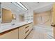 Well-lit bathroom features dual vanities, a soaking tub, and tiled flooring at 5240 Las Cruces Dr, Las Vegas, NV 89130