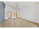 Bright, carpeted bedroom with neutral walls and doorways to bathroom and closet at 5240 Las Cruces Dr, Las Vegas, NV 89130