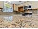 Modern kitchen with granite countertops, stainless steel appliances, and natural light at 5240 Las Cruces Dr, Las Vegas, NV 89130
