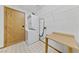 Functional laundry area with a washer, dryer, shelving, and tiled flooring at 5240 Las Cruces Dr, Las Vegas, NV 89130