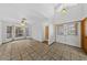 Bright living room with tile floors, high ceilings, and an entry door at 5240 Las Cruces Dr, Las Vegas, NV 89130