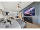 Staged main bedroom with a large TV and furniture at 5240 Las Cruces Dr, Las Vegas, NV 89130